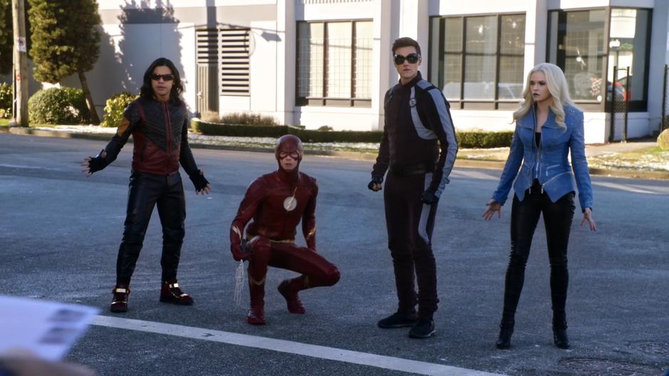 Cisco, Barry, Ralph, and Caitlin watch as Edwin Gauss puts some mail in the mailbox.