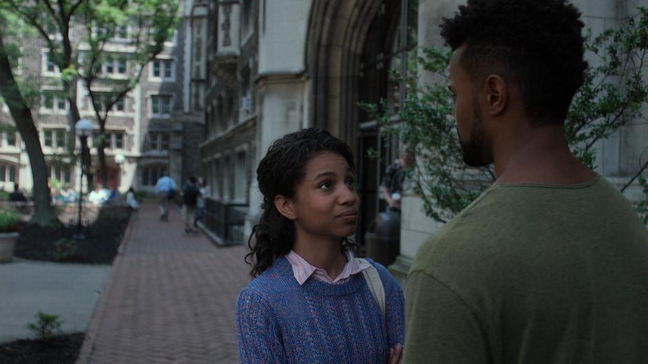 Nichelle looks up at Malcolm.