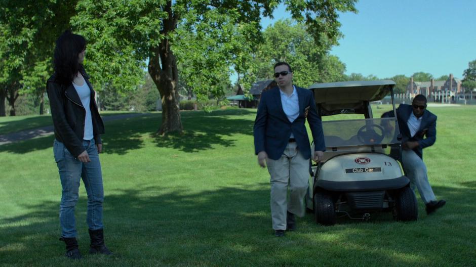 Two security guards get out of a golf cart to stop Jessica.