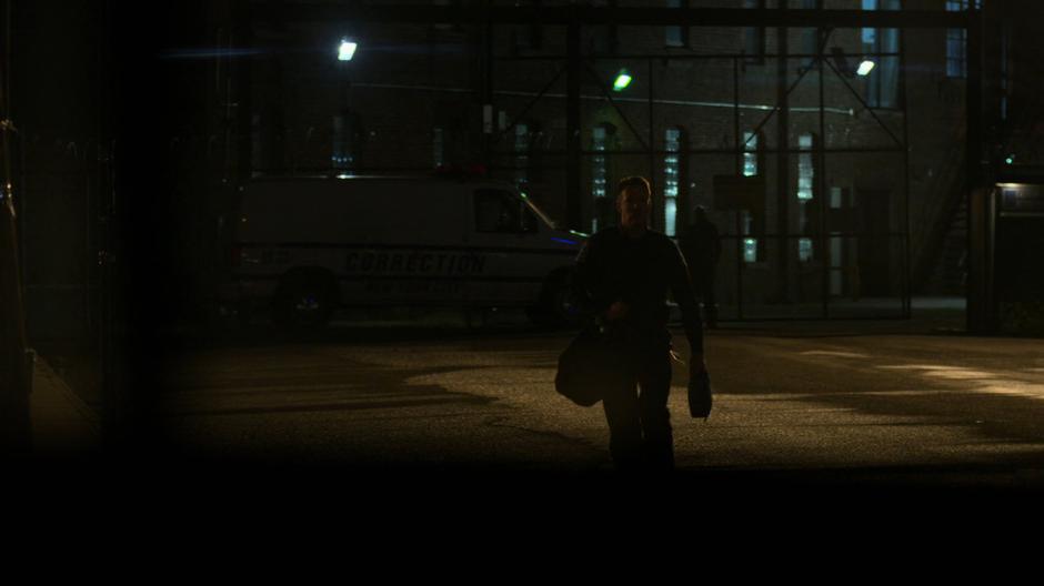 Dale Holiday walks towards the bus stop with his stuff.