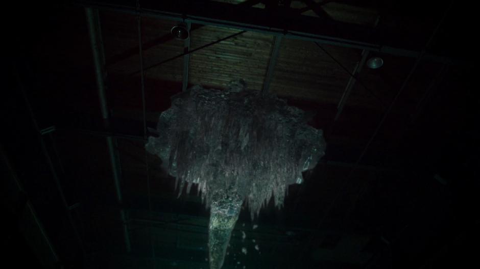 A giant icicle falls from the ceiling after being created with the cold gun.