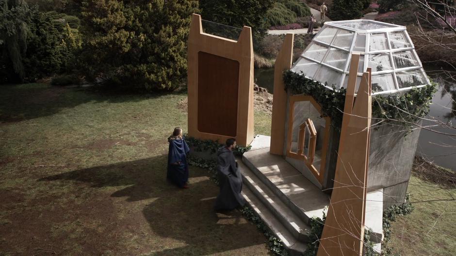 Kara and that guy examine the memorial chamber holding the stone.