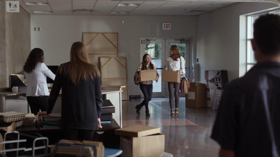 Hannah and the new staff watch Carmen as she tries to introduce herself.