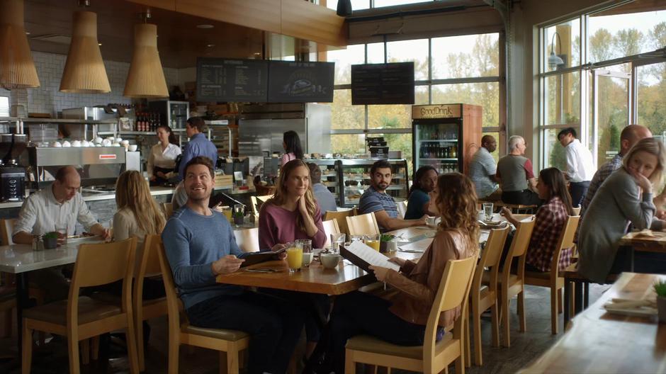 Jack and Emma look around the restaurant while Izzy checks out the menu.