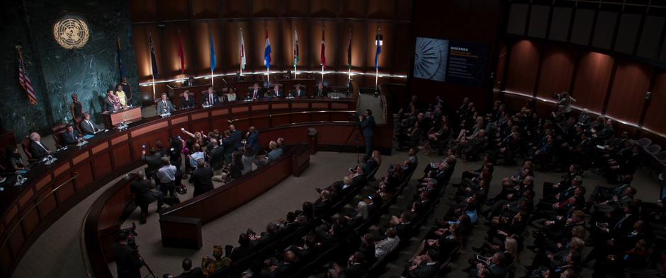 Delegates watch as T'Challa gives his speech about opening up to the world.