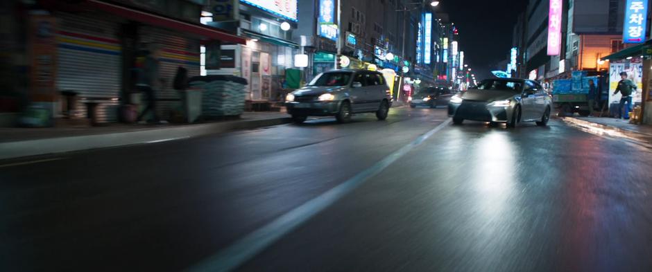 Nakia and Okoye's car swerves around the corner and races after Ulysses Klaue.