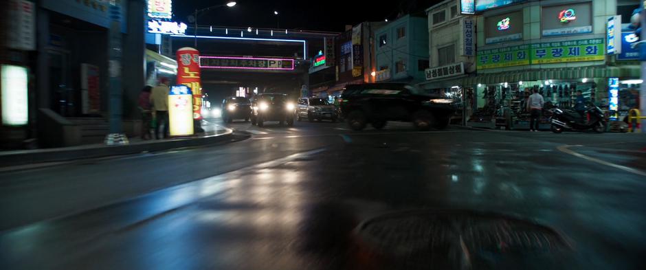 Ulysses Klaue's convoy of SUVs split up at an intersection.