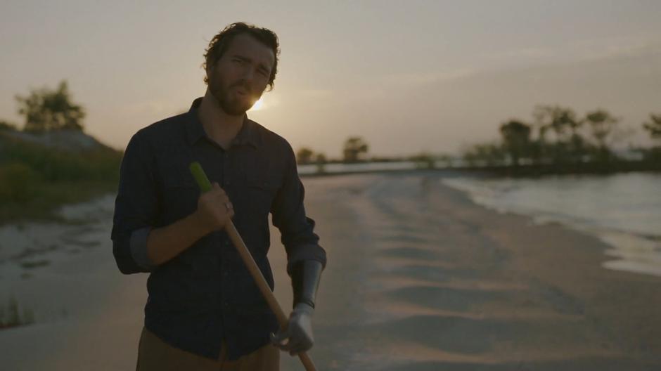 Louden Swift addresses the camera for a promotional video while cleaning up the beach.