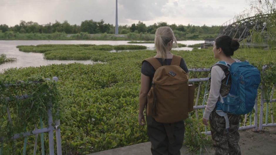 Tandy and Mina Hess look out over the swamp at the edge of the park.