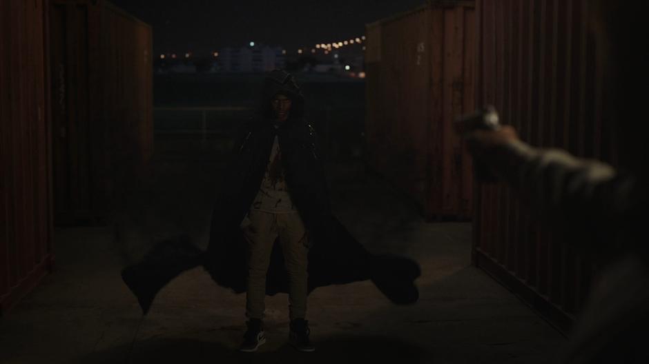 Tyrone appears in front of Connors with his bloody shirt and cloak.