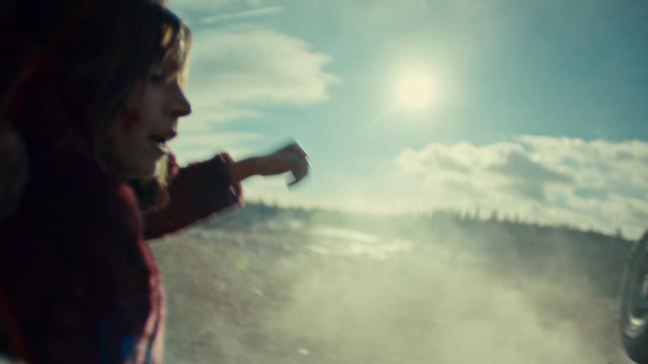 Waverly is dragged away from the crash by a mysterious individual.