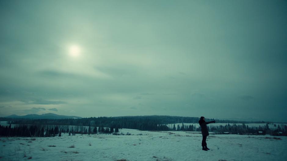 Wynonna shoots at targets on the hill above the homestead.