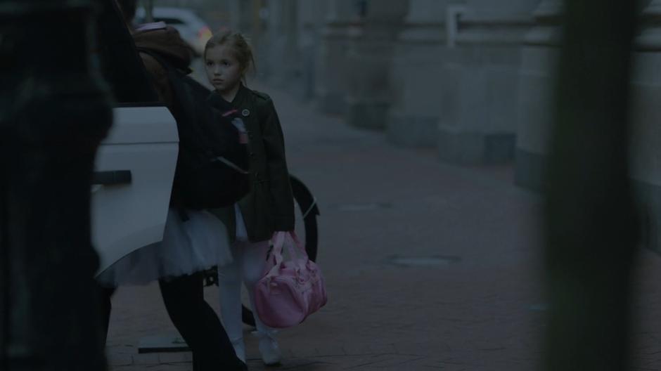 Tandy watches as her classmates leave with their parents.