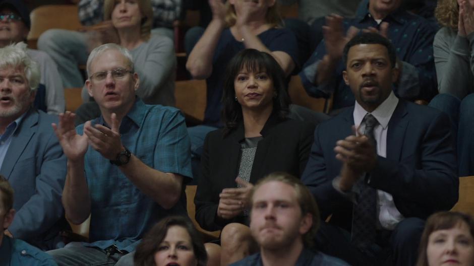 Adina and Otis cheer on Tyrone from the stands.