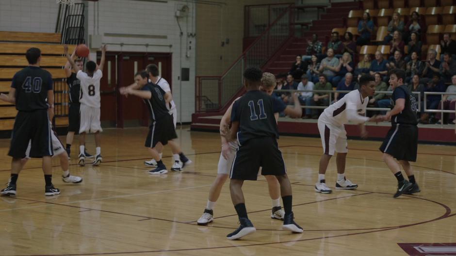 Tyrone tries to get around the player guarding him on the court.