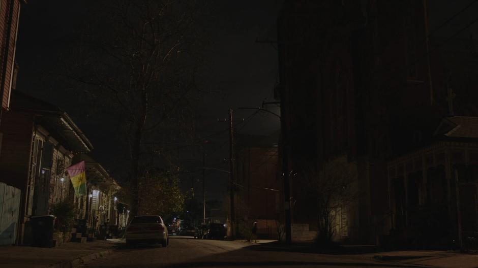 Tandy crosses the street to the abandoned church.