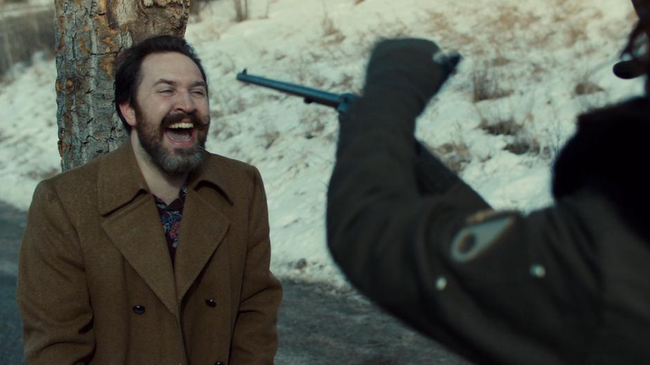 The Revenant laughs as Wynonna's gun fails to fire.