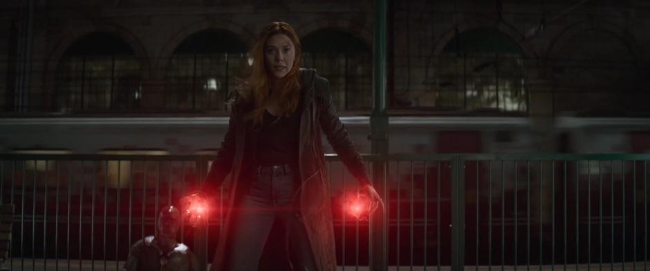 Wanda prepares her powers while standing in front of Vision.