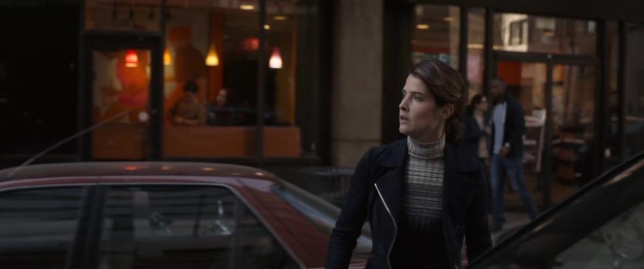 Maria Hill looks around after getting out of the SUV.