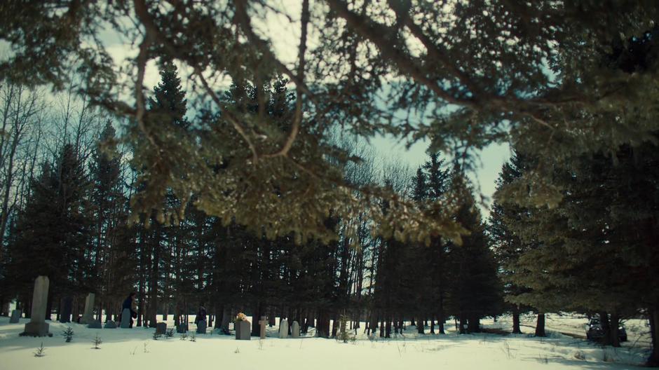 Doc follows Michelle as she walks back to the car through the graveyard.