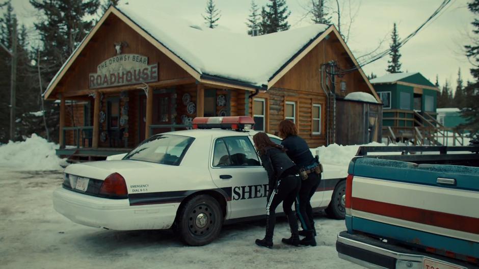 Wynonna and Nicole look into the car where Bunny is locked.