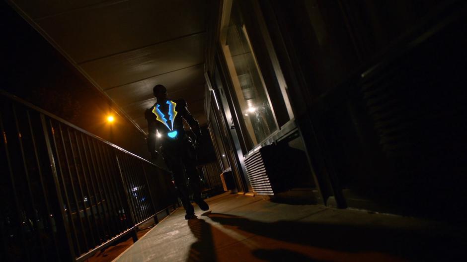 Jefferson stalks down the exterior hallway towards the room where his daughters are being held.