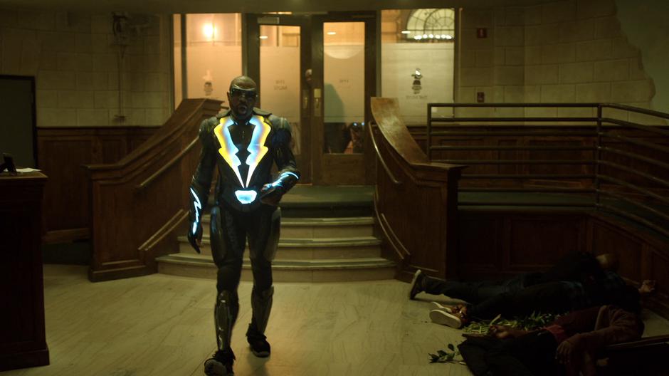 Jefferson walks across the lobby and heads towards the stairs.