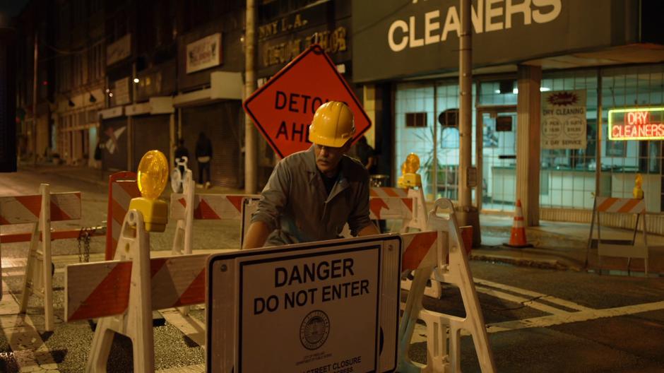 Gambi sets a barrier across the road to redirect the march.