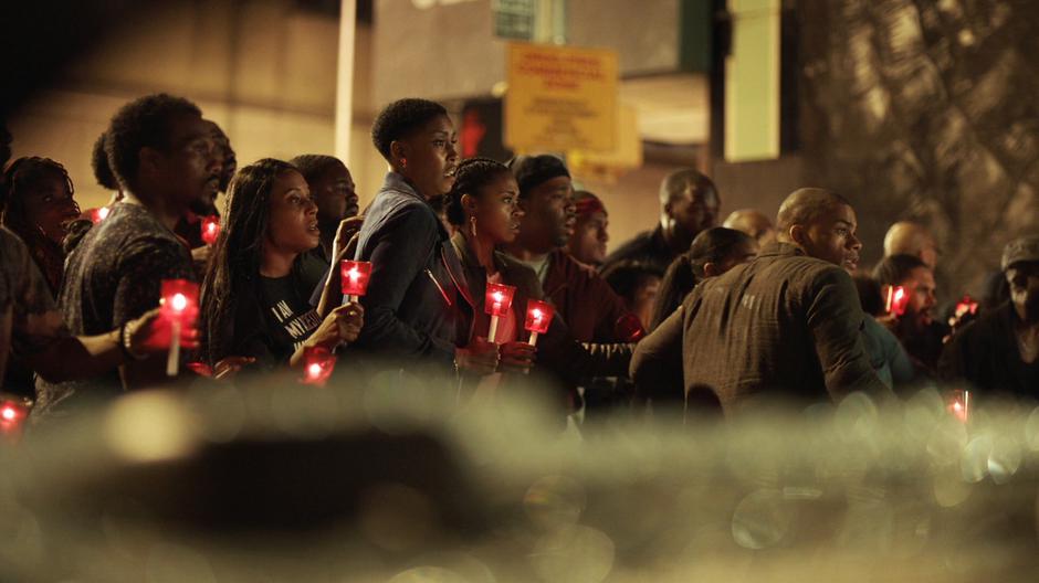 Lynn, Anissa, and the others push back when the gang member pulls out a rifle.