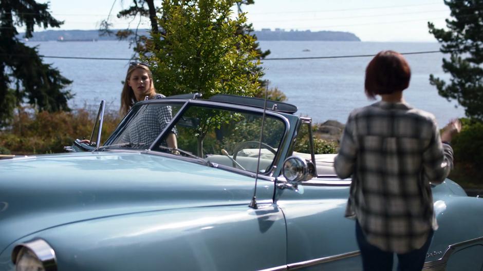 Kara and Alex get into the car in the driveway on their way out.