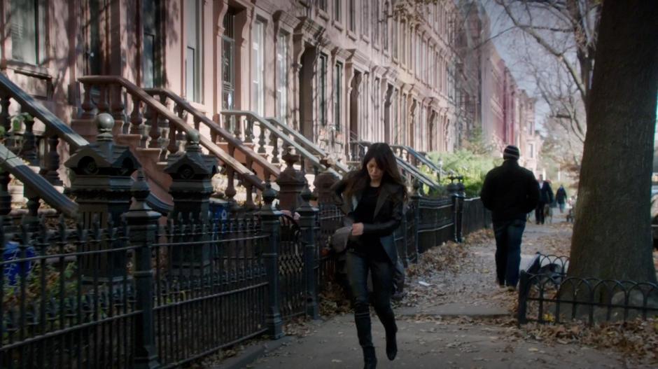 Kelli Lin walks to her apartment while Reese follows from down the block.