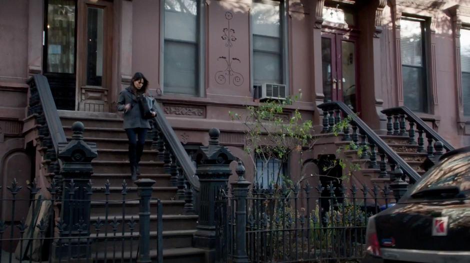 Kelli Lin walks down the stairs on her way out for the day.