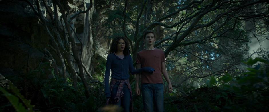 Meg holds Calvin back when she see something approaching through the forest.