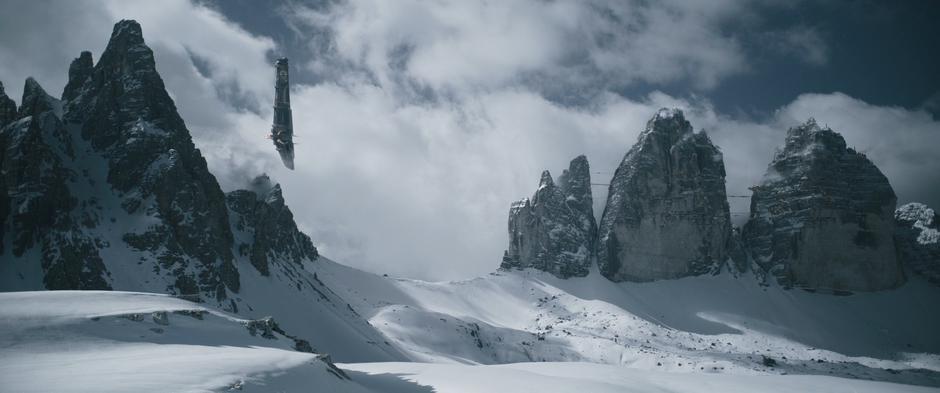 Dryden Vos's ship approaches between the mountain peaks.