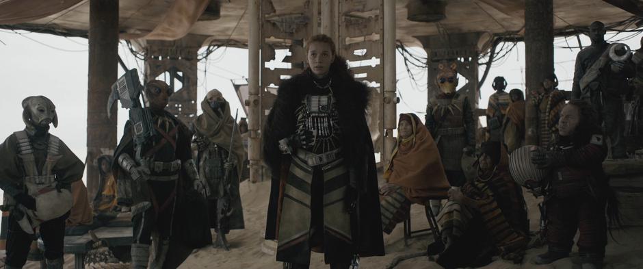 Enfys Nest explains the nature of her group while the other Cloud Riders take off their masks.