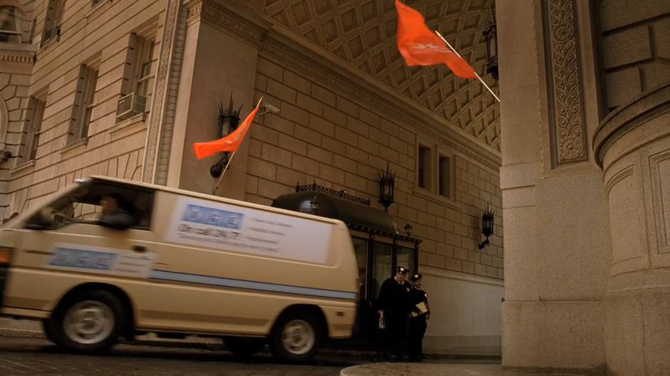 The guards watch as a maintenance van drives through the gate.