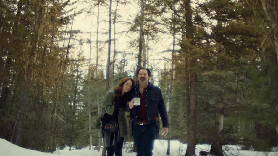 Wynonna and Doc walk arm-in-arm through the forest in Bulshar's haze.