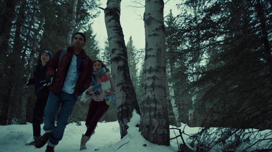 Nicole, Jeremy, and Waverly run through the woods to get to Doc & Wynonna.