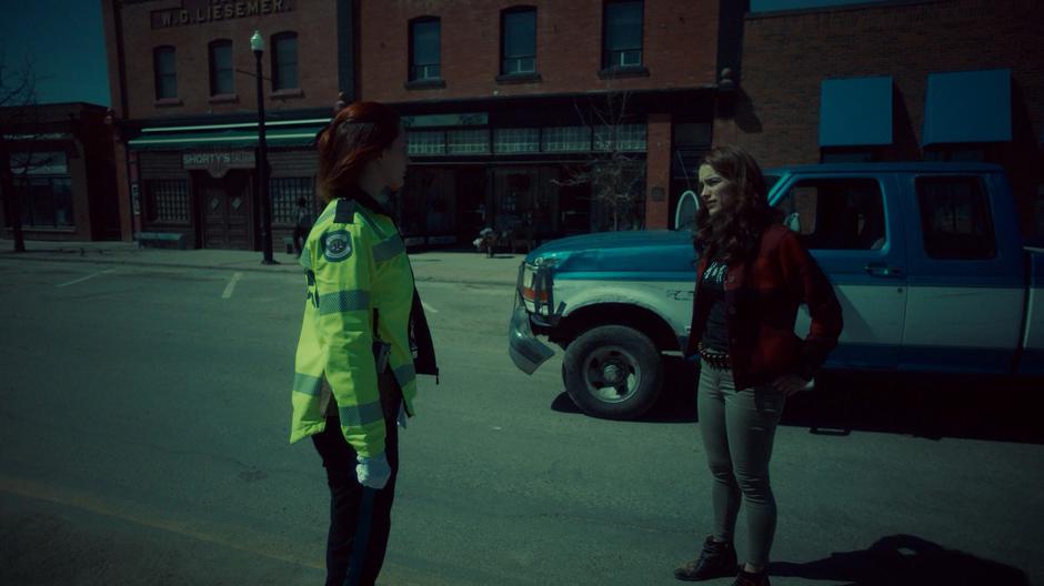 Wynonna stands in front of her truck in the middle of the street and asks Nicole where Waverly is located.
