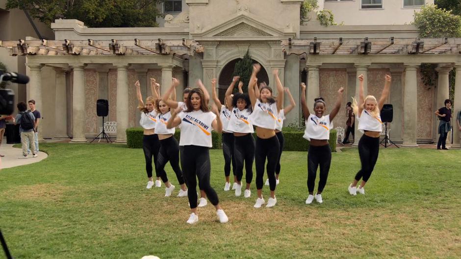 Eiffel leads the cheer group during a filmed practice in the yard.