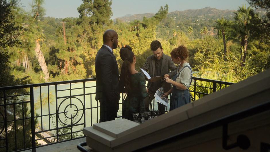 Geoffrey and Catherine watch as Dale and Stacey look over the plans on the outside landing.