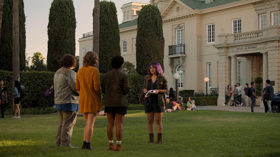 Gert talks to her three friends from her club in the front yard.