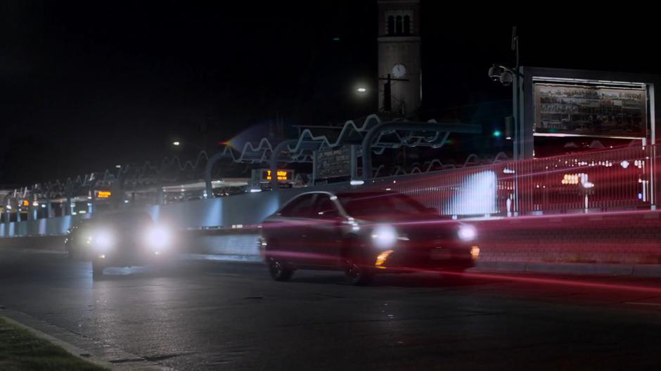 Karolina drives around another car while following Alex's trail.