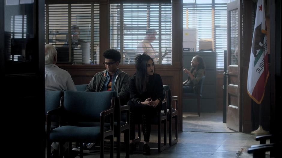 Alex and Nico sit in the waiting room at the police station for a chance to talk with the detective.