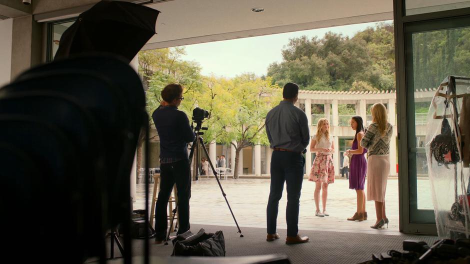 Karolina talks to Destiny during her interview at the edge of the courtyard.