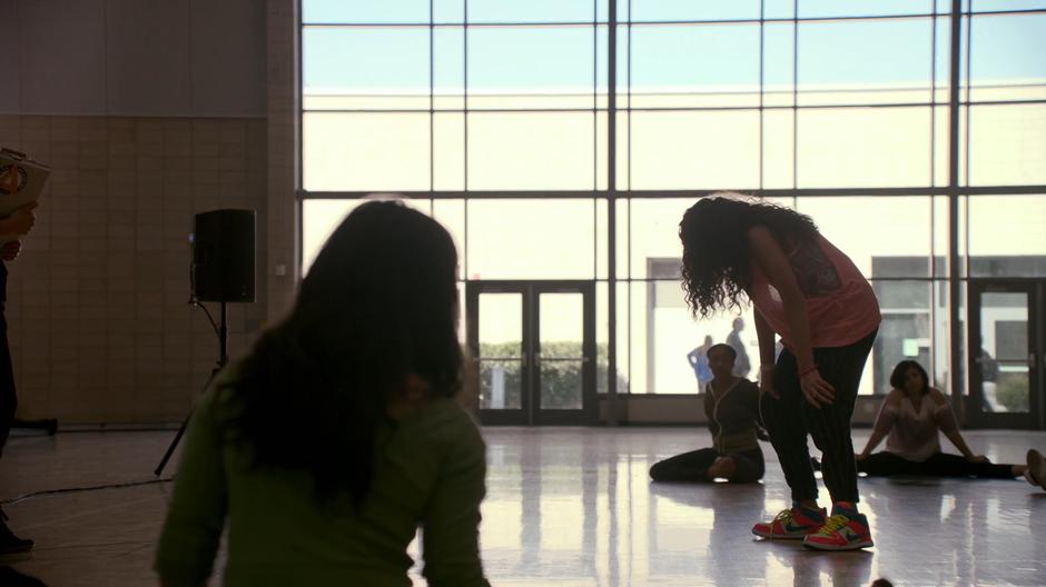 Molly leans over in pain in the middle of her audition.