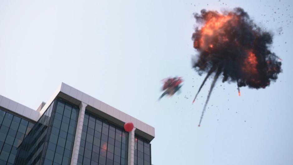 Kara flies down towards the escaped balloon after destroying the meteor.