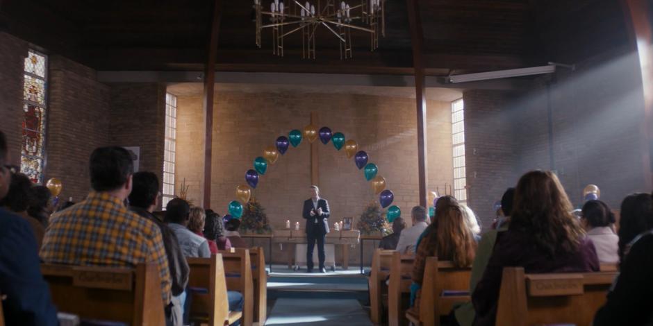 Graham delivers the eulogy at the front of the church.