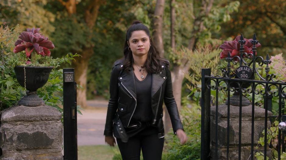 Mel walks up the steps of the house and sees Maggie waiting for her.