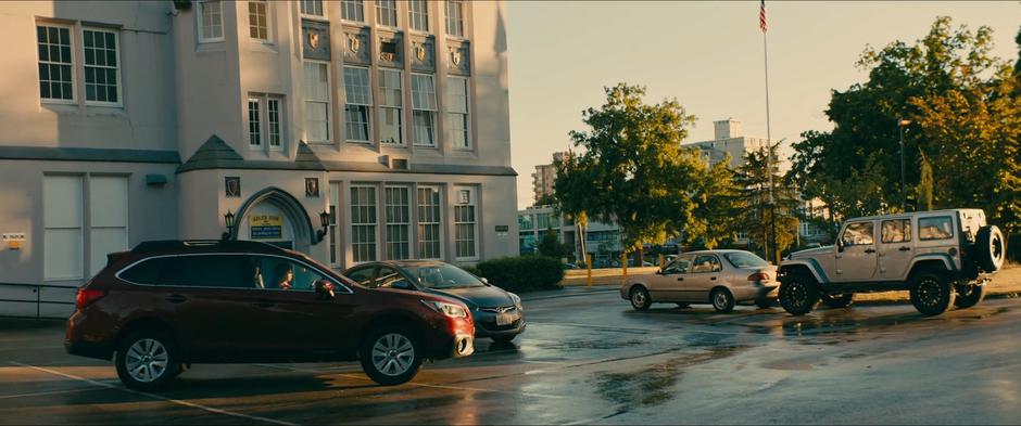 Lara Jean poorly parks in the side lot on her way to see Peter.